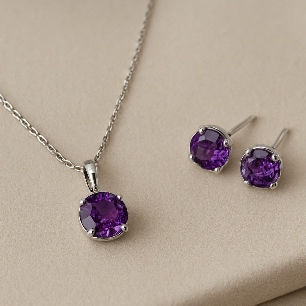 Amethyst necklace and earrings on a beige background